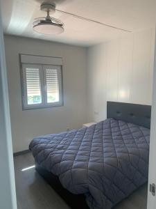 Ένα ή περισσότερα κρεβάτια σε δωμάτιο στο Apartamento en casa particular en Moraira