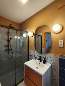 a bathroom with a sink and a shower at Surányi kék házak in Pócsmegyer +30 photos