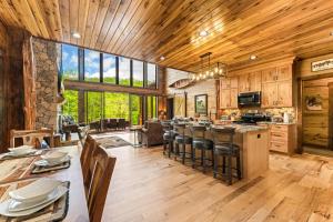 an open kitchen with wooden floors and a large window at Enchanting Riverscape in Townsend