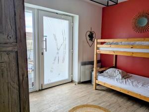 Ένα ή περισσότερα κρεβάτια σε δωμάτιο στο Maison garde barrière