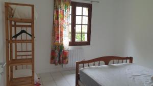 Letto o letti in una camera di Le Gîte du Lac d'Hostens