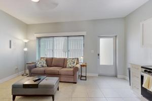 a living room with a couch and a table at 53 Steps to Beach in Clearwater Beach