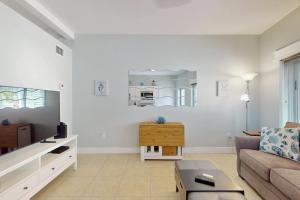 a living room with a couch and a table at 53 Steps to Beach in Clearwater Beach +16 photos