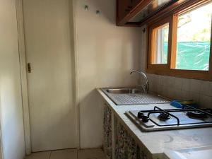 Kuchyň nebo kuchyňský kout v ubytování Casa Paradiso - Baia Porto Selvaggio