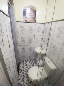 a bathroom with a toilet and a sink at Casa para COP30 no Centro de Belém in Belém +19 photos