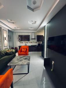 a living room with a couch and a table at Apartment in Bahria Town Grand heights 8 Lahore in Lahore