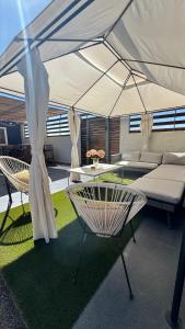 a living room with a tent and chairs and a table at Casa Andes in San Pedro de Atacama