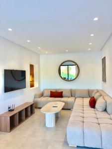 a living room with a couch and a table at Villa Elysia in Ech Chaïbat