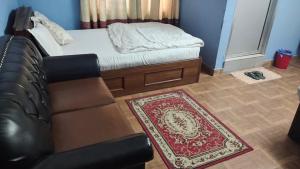 Postel nebo postele na pokoji v ubytování Hotel New Samrat