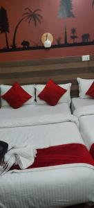 Postel nebo postele na pokoji v ubytování Hotel New Samrat