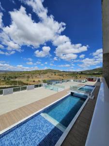 a swimming pool on the roof of a building at Home Duplex Serra Negra - casa 8 in Bezerros