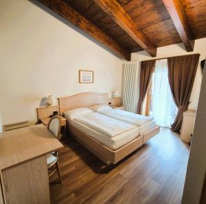 Posteľ alebo postele v izbe v ubytovaní Hotel Angelica