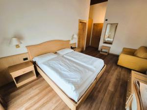 Posteľ alebo postele v izbe v ubytovaní Hotel Angelica