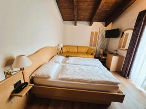 Posteľ alebo postele v izbe v ubytovaní Hotel Angelica