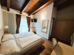 Posteľ alebo postele v izbe v ubytovaní Hotel Angelica