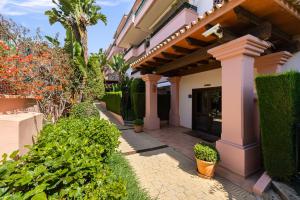 a house with a walkway leading to the front door at Río Real Vista Golf, by Homing U in Marbella