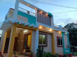 a model of a house in front at SiLENT SPRING RESIDENCY in Yelagiri