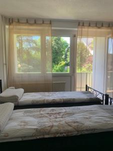 Postel nebo postele na pokoji v ubytování Apartment Aqualonnähe