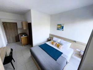 Postel nebo postele na pokoji v ubytování Sotirakis Hotel