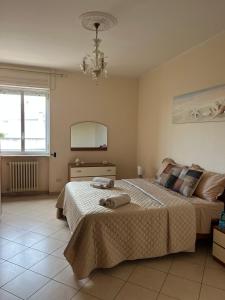 a bedroom with two beds and a mirror at Casa Lucia in Otranto