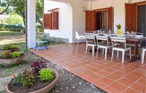 a patio with a table and chairs on it at Amazing Home In Castellabate With Wifi in Castellabate