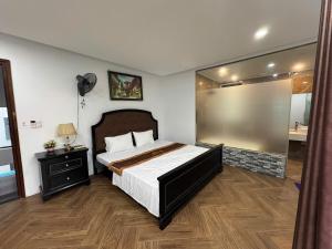 En eller flere senge i et værelse på Ngọc Trai 76 FLC Sầm Sơn