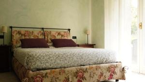 Postel nebo postele na pokoji v ubytování Appartamenti Villa Lina