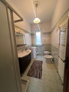 a bathroom with a sink and a toilet at Casa Lucia in Otranto