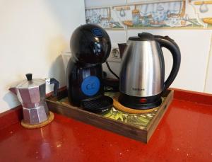 a coffee maker and a tea kettle on a counter at Casa la Sonrisa shared house in El Médano
