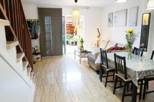 a living room with a table and a couch at Casa la Sonrisa shared house in El Médano