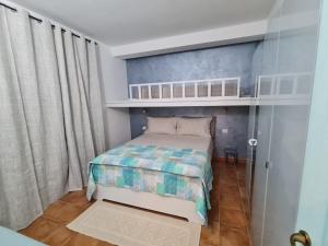 A bed or beds in a room at La Casa di Orimari