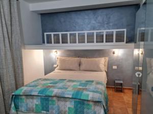 A bed or beds in a room at La Casa di Orimari