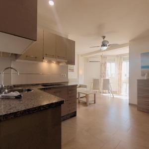 a kitchen with a sink and a counter top at Terrasol Estudios Plazamar in Torre del Mar