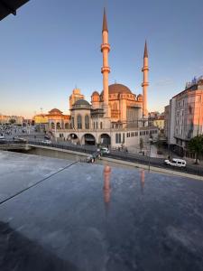 a large building with two mosques in a city at The Square 30 in Istanbul