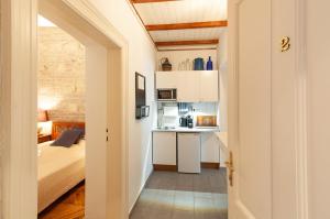 Posteľ alebo postele v izbe v ubytovaní BudaFlats Apartments
