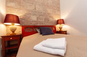 Posteľ alebo postele v izbe v ubytovaní BudaFlats Apartments