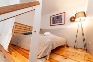 Posteľ alebo postele v izbe v ubytovaní BudaFlats Apartments