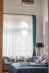 Posteľ alebo postele v izbe v ubytovaní BudaFlats Apartments