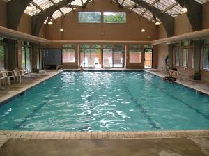 a large indoor swimming pool in a building at Mount Hood Village Yurt 1 in Welches