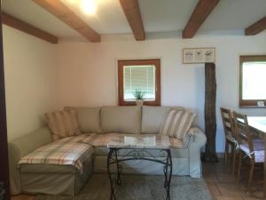 a living room with a couch and a table at Apartments Vila Cvetka Bled in Bled