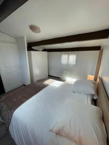 Postel nebo postele na pokoji v ubytování coccon 7 + 2 fotografie