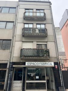 a building with a sign that reads esparo faza at OPORTO APARTMENT LUXURY in Porto
