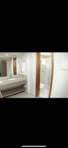 a bathroom with a sink and a mirror at Bastos e Silva in Caldas Novas