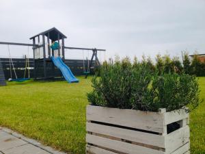 a park with a playground with a slide at Gajowa Przystań in Sianozety