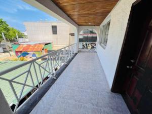 a balcony with a view of a pool at Apartamentos Limsor Beach Vista al mar in San Andrés