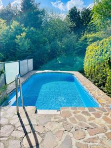 a swimming pool in the middle of a garden at Ferienhaus Fuxbau in Wohlau