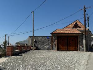 a building with a large door on the side of it at Burj Sheki in Sheki