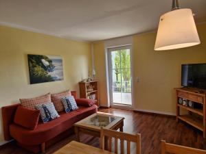 TV a/nebo společenská místnost v ubytování Apartmenthaus Ostseeluft