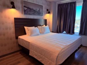 Postel nebo postele na pokoji v ubytování Bkway Hotel Brooklyn