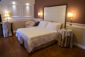 Voodi või voodid majutusasutuse Parco del Lago Resort & SPA toas